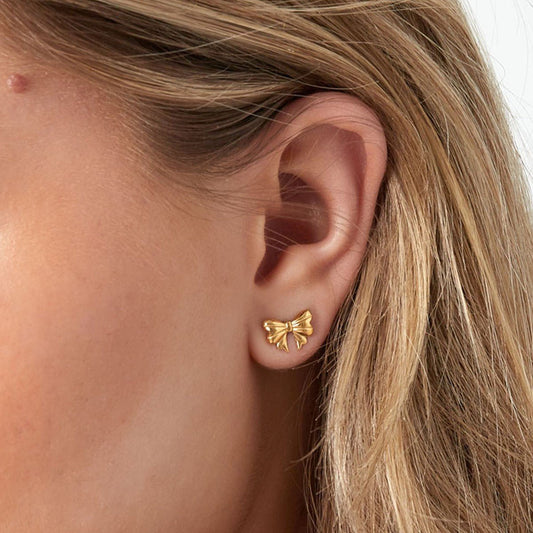 Schattige gouden strikoorbel